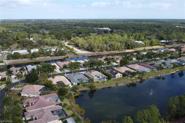 Aerial overview of property's location featuring nearby suburban area and a large body of water
