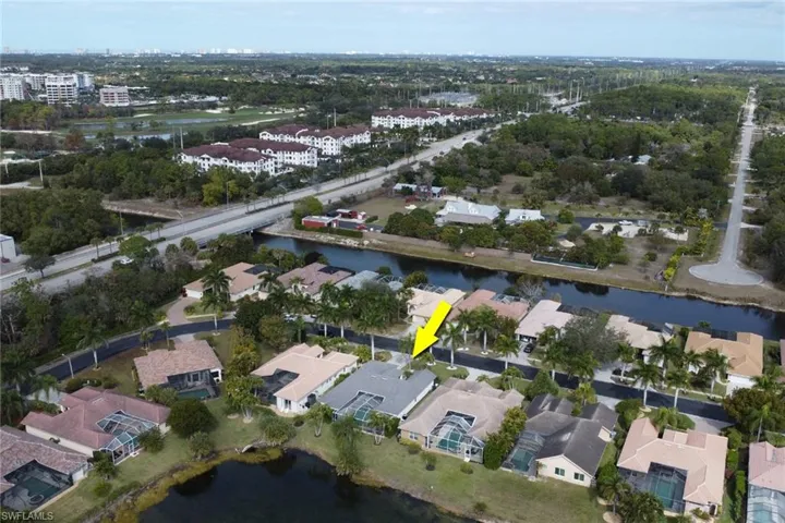 Aerial view of property's location featuring a nearby body of water