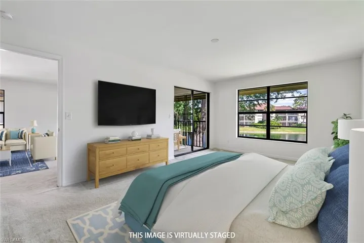 Virtually Staged with view of the lanai and lake
