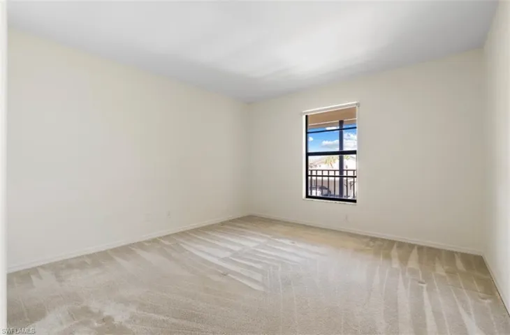 2nd Bedroom showcasing the space and the light from bedroom window.
