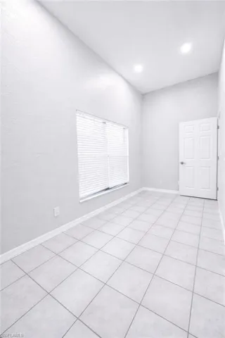 Unfurnished room featuring recessed lighting and light tile patterned floors