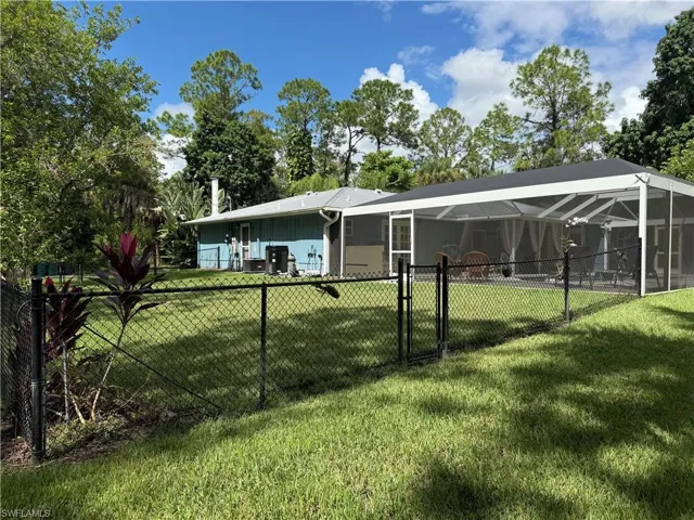 New side fenced yard off living room and pool area.