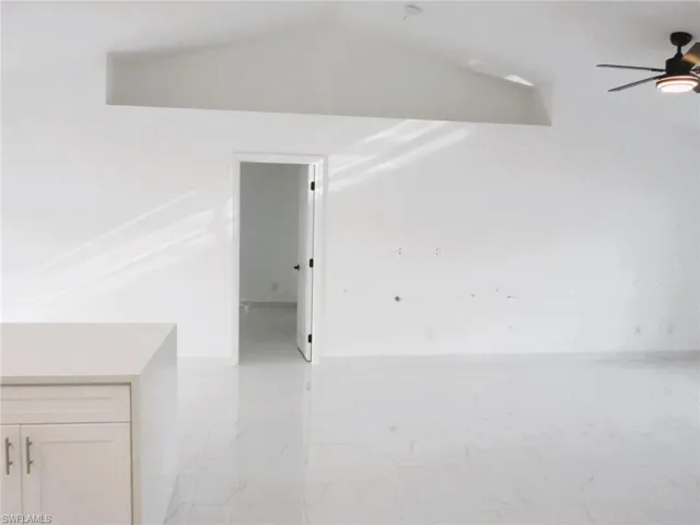 Unfurnished room with a ceiling fan