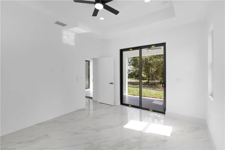 Spare room featuring light marble finish flooring, recessed lighting, and ceiling fan