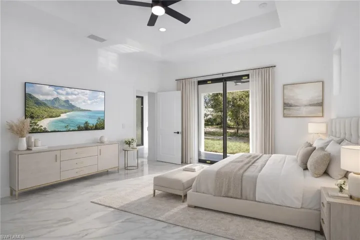 Bedroom featuring access to outside, a raised ceiling, a ceiling fan, light marble finish flooring, and recessed lighting