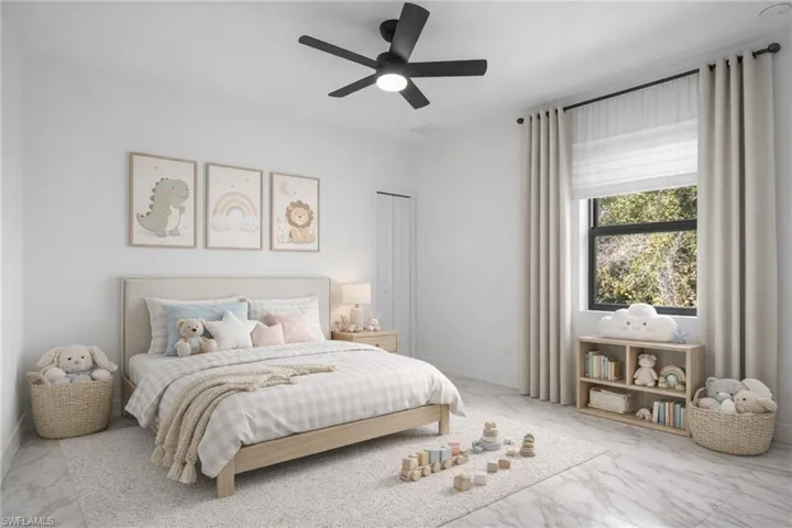 Bedroom featuring light marble finish floors and ceiling fan