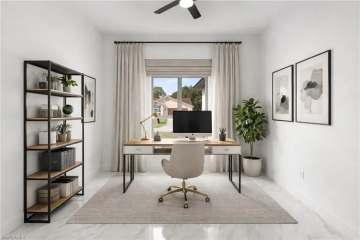 Office area featuring a ceiling fan and light marble finish floors