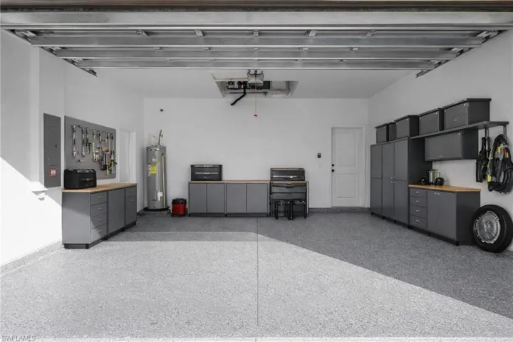 Garage with electric panel and electric water heater
