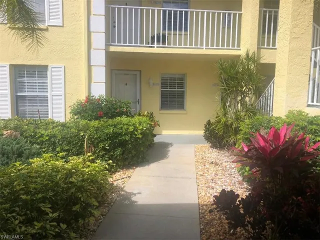 Doorway to property with stucco siding