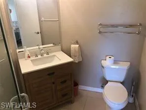 Bathroom featuring vanity and light tile patterned floors