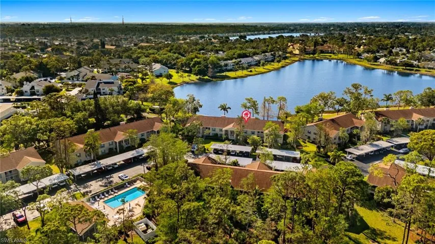 Aerial view featuring a residential view and a water view