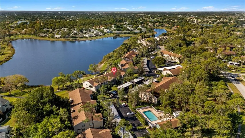 Birds eye view of property featuring a residential view and a water view
