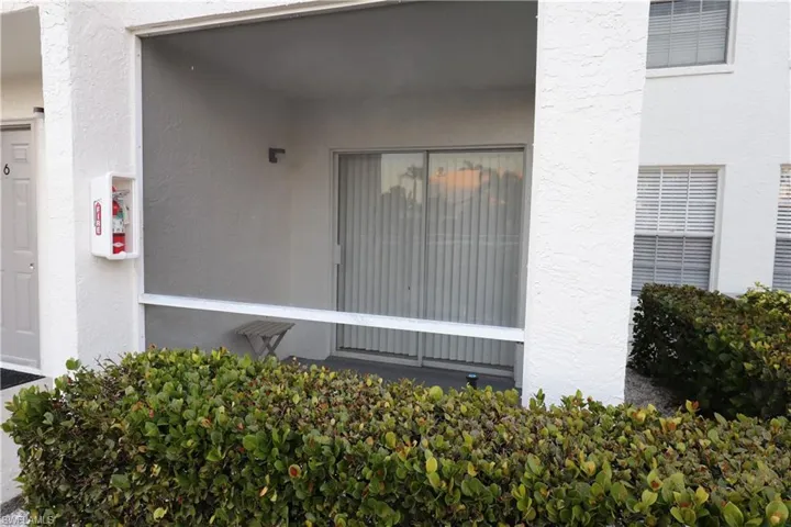 View of exterior entry featuring stucco siding