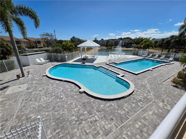 Community pool with a gazebo and a patio