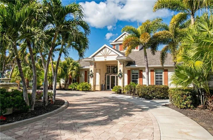 View of property with curved driveway