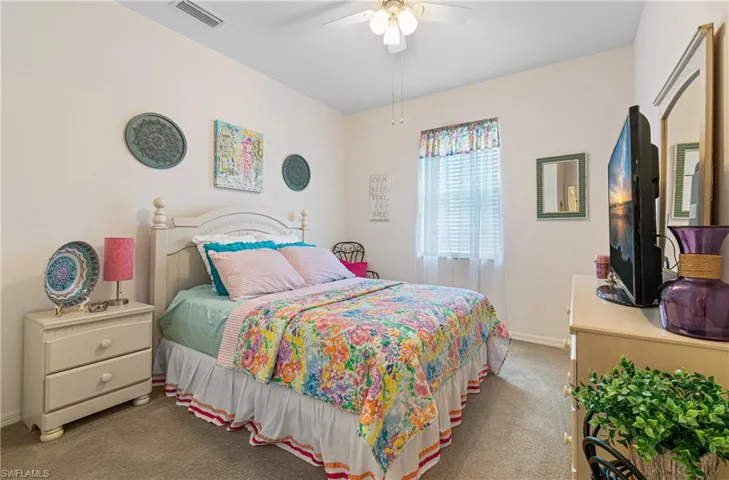 Guest Bedroom 1 featuring carpet and ceiling fan