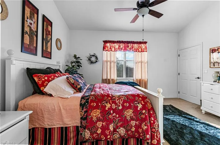 Main Bedroom with ceiling fan and carpet flooring