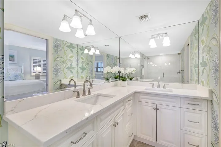 Primary bathroom with dual sinks.