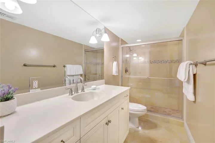Guest bathroom with linen closet.