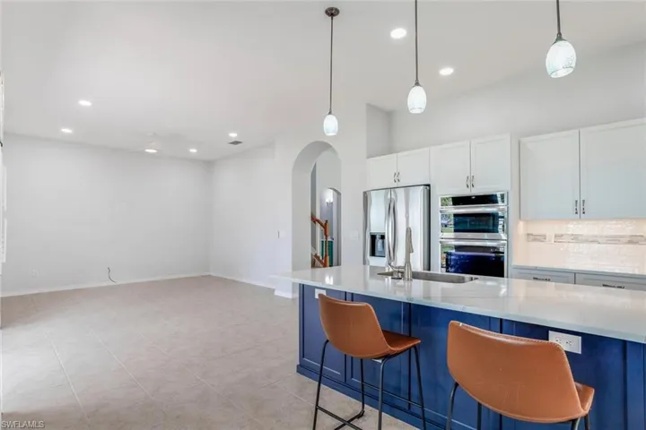 Family Room w/ Tile Flooring and Recessed Lighting