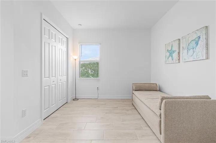 Living area featuring light tile patterned flooring