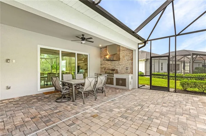 Sunroom / solarium featuring ceiling fan