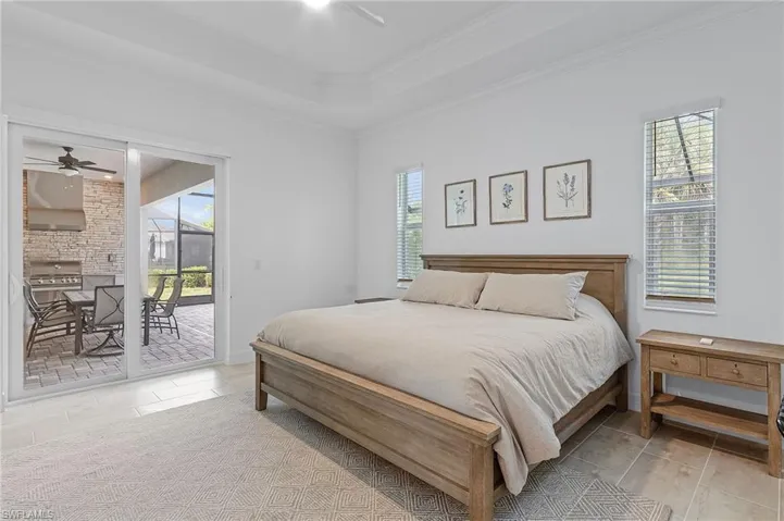 Bedroom featuring multiple windows and access to exterior