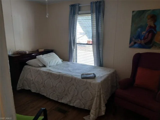Bedroom with wood finished floors