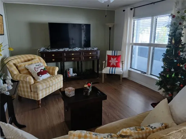 Living room with wood finished floors and baseboards