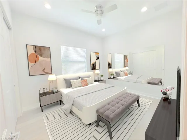 Bedroom featuring ceiling fan and light hardwood / wood-style floors