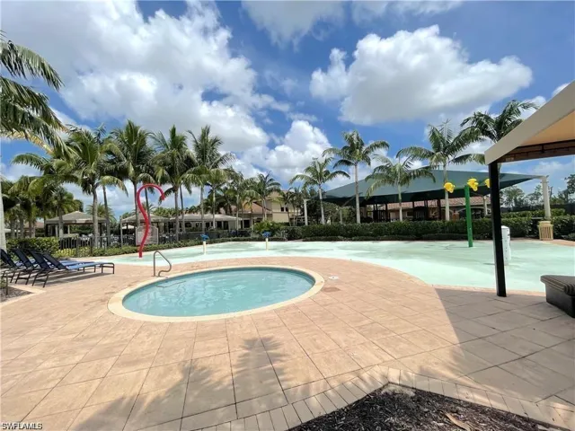View of pool featuring a hot tub