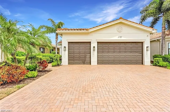 View of front of property featuring a garage