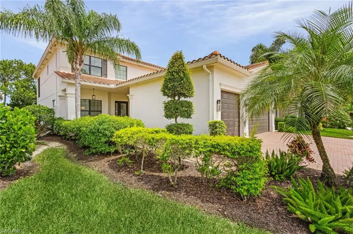 Mediterranean / spanish-style home featuring a garage