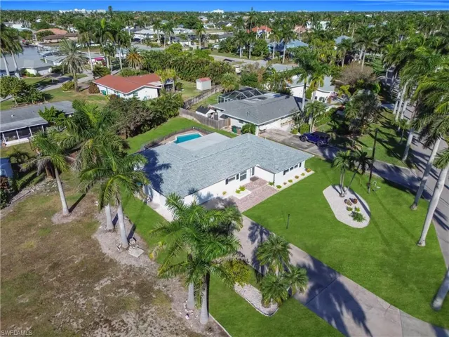 Aerial view of residential area featuring a pool area