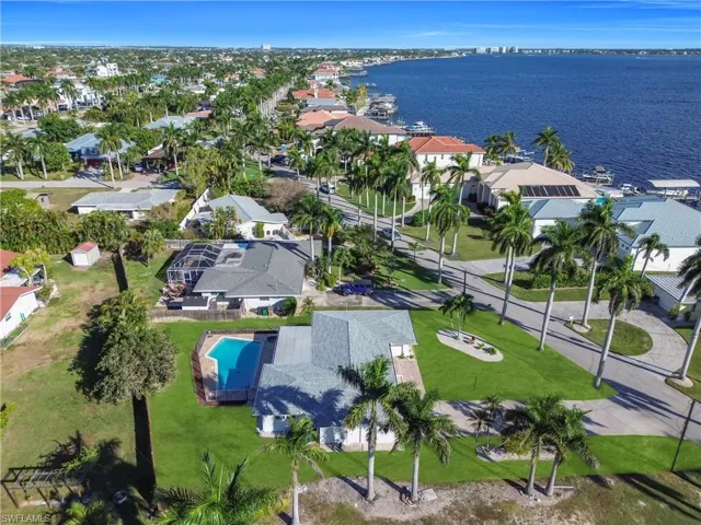 Aerial perspective of suburban area with a large body of water