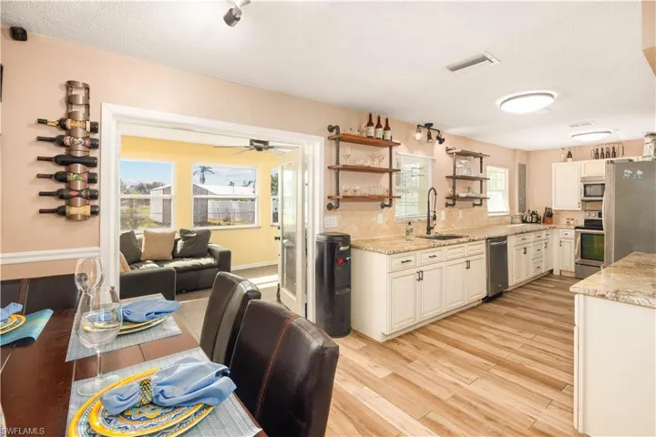 Kitchen with gorgeous granite counters, stainless steel appliances, custom cabinets