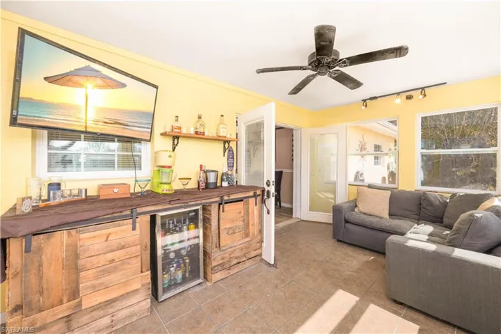 Family room is great for entertaining (bar and beverage cooler are excluded)
