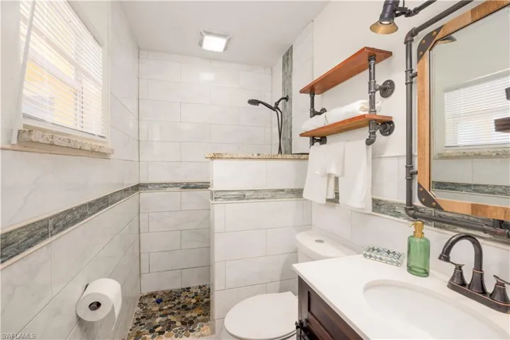 Primary Bathroom  updated with gorgeous tile and modern vanity