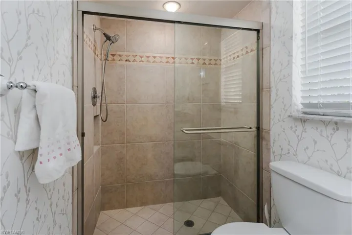 Large tiled shower in main bathroom