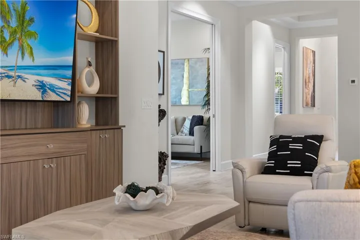 Sitting room with light hardwood / wood-style tile floors
