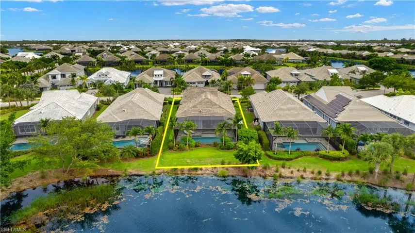Birds eye view of property with a water view and lot lines