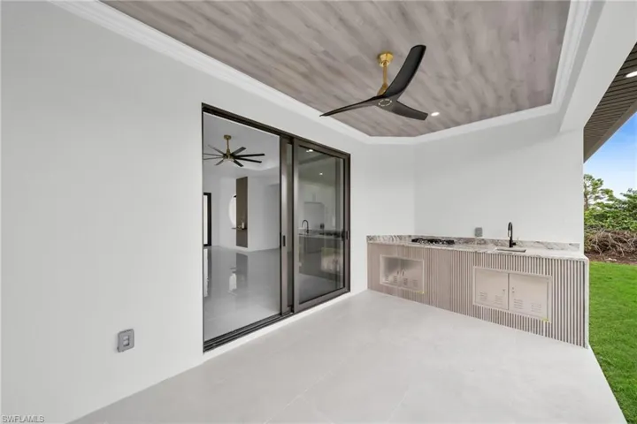 View of patio with a ceiling fan