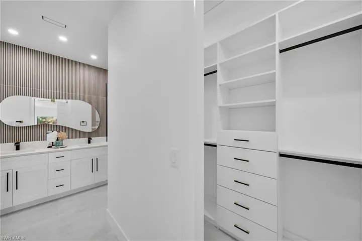 Spacious closet featuring a sink