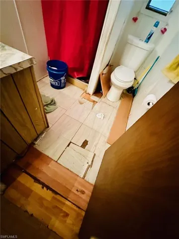 Bathroom with vanity and toilet