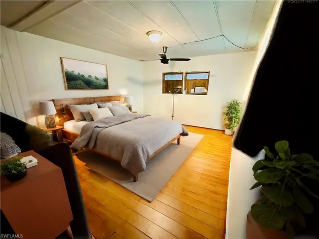 Virtually Staged Bedroom with hardwood / wood-style floors