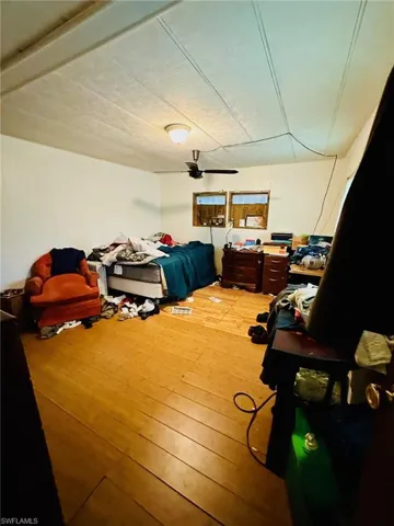 Bedroom featuring wood-type flooring
