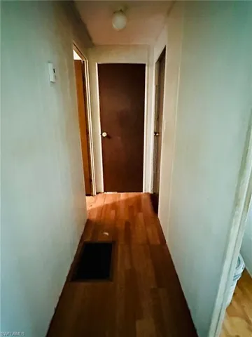 Hallway featuring wood-type flooring