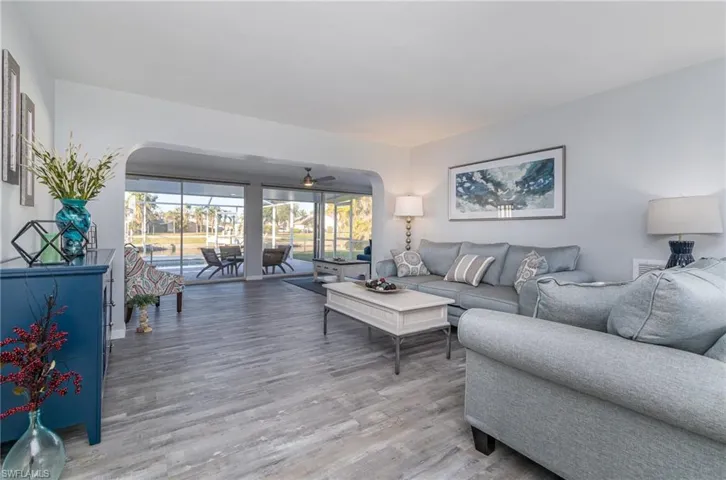 Living room with hardwood / wood-style flooring