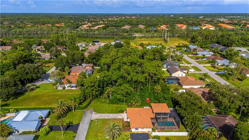 Aerial overview of property's location with nearby suburban area
