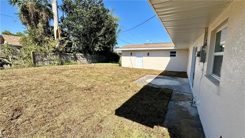 View of yard featuring fence